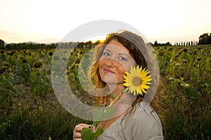 Happy beautiful woman with sunflower