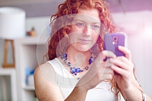 Happy beautiful young businesswoman using smart phone smiling