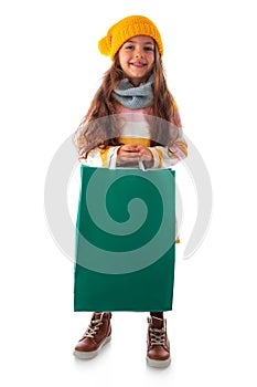 Happy beautiful young girl with shopping bag, portrait on white background