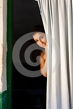 Happy behind a curtain