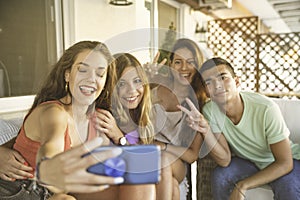 Happy Best Friends Taking Selfie on a Balcony.