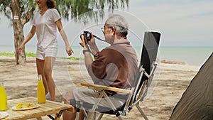 Happy big Asian family travel beach on holiday vacation