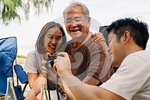 Happy big Asian family travel beach on holiday vacation