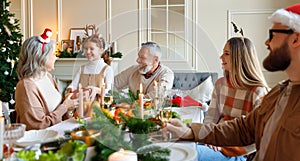 Happy big family with children exchanging gifts on Christmas morning at home