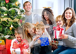 Happy Big family with Christmas presents at hom