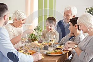 Happy big family eating dinner