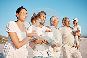 Happy, big family and relax on beach for holiday, weekend or fun vacation together in the nature outdoors. Grandparents