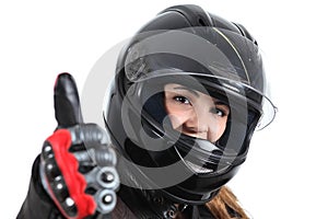 Happy biker woman with a road helmet and thumb up