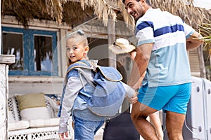 Happy biracial family walking at beach