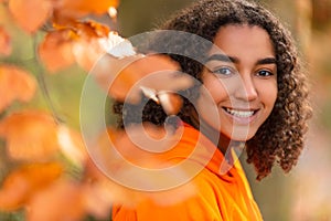 Happy Biracial Mixed Race African American Girl Teenager Smiling In Autumn or Fall