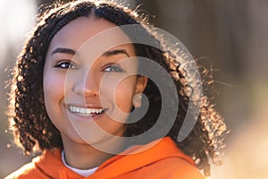 Happy Biracial Mixed Race African American Girl Teenager Smiling With Perfect Teeth