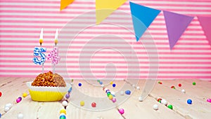 Happy birthday for 54 years old. Festive background with muffin. Copy space birthday card for fifty four years old on a pink