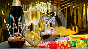 Happy birthday background with champagne glasses with number cake 54. Beautiful birthday card with decorations copy space