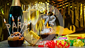Happy birthday background with champagne glasses with number cake 72. Beautiful birthday card with decorations copy space
