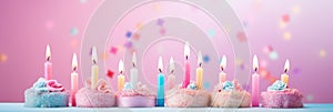 happy birthday banner background with cakes and candles on pink background.