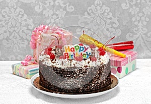 Happy Birthday Black Forest Chocolate Cake with gifts.