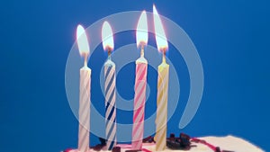 Happy Birthday cake with burning spiral candles