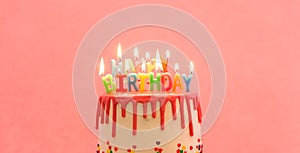 happy birthday cake. happy birthday candles. Cake on pink background.