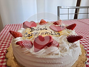 Happy Birthday Cake With Happy Birthday Lettering In Italian