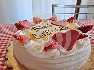 Happy Birthday Cake With Happy Birthday Lettering In Italian