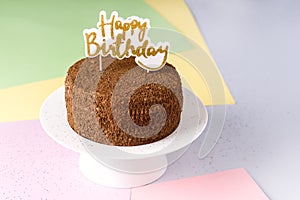 Happy Birthday Candles on Chocolate Cake Tasty Chocolate Homemade Cake for Holiday Muiticolored Background Copy Space