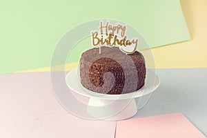 Happy Birthday Candles on Chocolate Cake Tasty Chocolate Homemade Cake for Holiday Muiticolored Background Copy Space