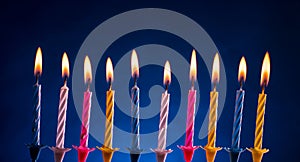 Happy birthday candles over blue