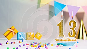 Happy birthday card from candles with the number 13, golden numbers from candles for congratulations on any holiday with beautifu