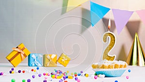 Happy birthday card from candles with the number 2, golden numbers from candles for congratulations on any holiday with beautiful