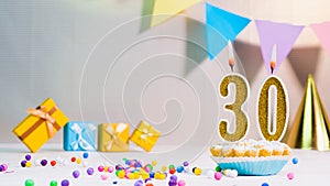 Happy birthday card from candles with the number 30, golden numbers from candles for congratulations on any holiday with beautiful