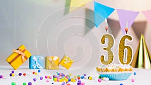 Happy birthday card from candles with the number 36, golden numbers from candles for congratulations on any holiday with beautifu