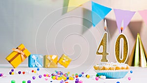 Happy birthday card from candles with the number 40, golden numbers from candles for congratulations on any holiday with beautiful