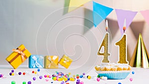 Happy birthday card from candles with the number 41, golden numbers from candles for congratulations on any holiday with beautifu
