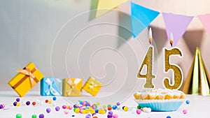 Happy birthday card from candles with the number 45, golden numbers from candles for congratulations on any holiday with beautiful