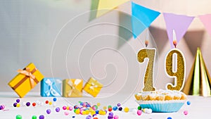 Happy birthday card from candles with the number 79, golden numbers from candles for congratulations on any holiday with beautiful
