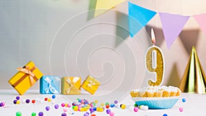 Happy birthday card from candles with the number 9, golden numbers from candles for congratulations on any holiday with beautiful