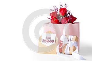 Happy birthday card with gift box and rose in paper bag isolated on white background