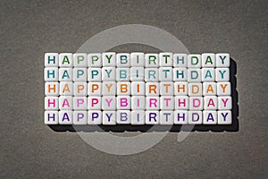 Happy Birthday closeup on grey background