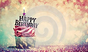 Happy birthday cupcake on glitter colorful background