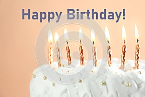 Happy Birthday! Delicious cake with burning candles on beige background, closeup