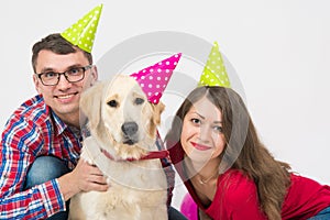 Happy birthday dog with friendly family over white