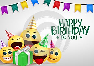 Happy birthday emoji vector greeting design. Happy birthday to you greeting text with cute smiley emoji in party elements.