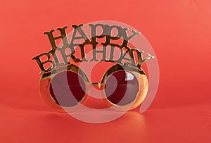 Happy birthday goggles on red background - celebration theme wallpaper