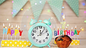 Happy birthday greeting card with muffin pie and retro clock on clock hands new birth. Beautiful background with decorations