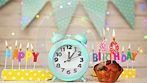 Happy birthday greeting card with muffin pie and retro clock on clock hands new birth. Beautiful background with decorations