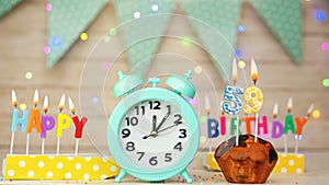 Happy birthday greeting card with muffin pie and retro clock on clock hands new birth. Beautiful background with decorations