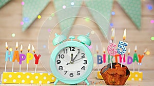 Happy birthday greeting card with muffin pie and retro clock on clock hands new birth. Beautiful background with decorations