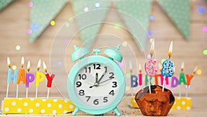 Happy birthday greeting card with muffin pie and retro clock on clock hands new birth. Beautiful background with decorations