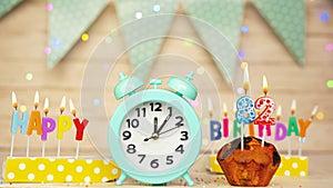 Happy birthday greeting card with muffin pie and retro clock on clock hands new birth. Beautiful background with decorations