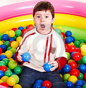 Happy birthday of little boy in balls.